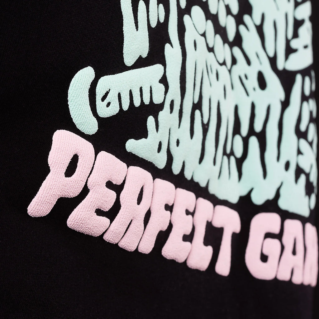 Textured fabric with 'PERFECT GAME' in pink on a black background